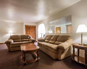 a living room with a couch and a table at Malone Inn in Malone