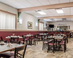 a dining room filled with tables and chairs at Quality Inn in Niagara Falls