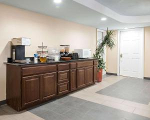 a kitchen with a counter top with at Rodeway Inn Syracuse in East Syracuse