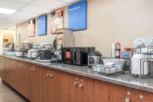 a kitchen with a counter top with a counter at Comfort Inn & Suites Piqua-Near Troy-I75 in Piqua