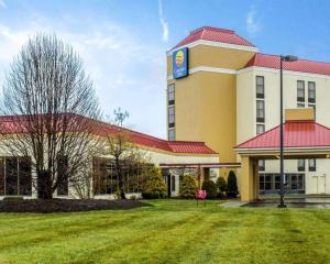 a large building with a red roof at Comfort Inn Alliance in Alliance