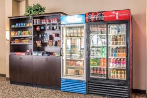 a store refrigerator with its doors open in a room at Comfort Inn & Suites Piqua-Near Troy-I75 in Piqua