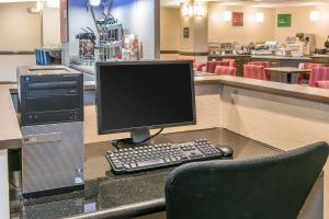 a computer monitor sitting on a desk in a store at Comfort Suites Springfield in Springfield