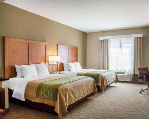a hotel room with two beds and a window at Comfort Inn & Suites West Chester - North Cincinnati in West Chester