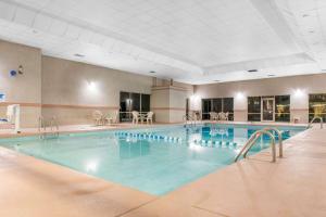 a large swimming pool in a hotel room at Quality Inn Dayton Airport in Englewood