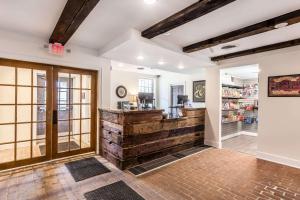 a large room with a lobby with a counter at The Aurora Inn Hotel and Event Center in Aurora