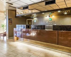 a lobby with a counter in a building at Quality Inn Ada near University in Ada