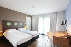 Postel nebo postele na pokoji v ubytování Hotel De Pits