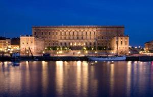 a large building in front of a large body of water at Executive Living Old Town Unique in Stockholm