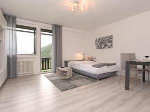 En eller flere senge i et værelse på Appartamento Dolomiti