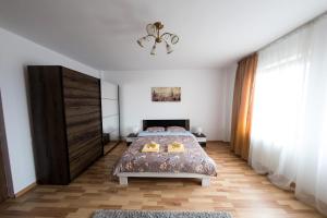 Säng eller sängar i ett rum på Travel Homzzz Apartments