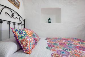 Postel nebo postele na pokoji v ubytování Casa Cueva Calatrava