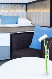 Cama ou camas em um quarto em Hotel Neptun