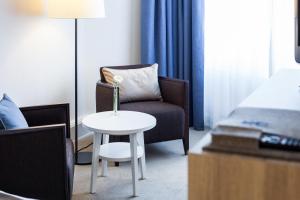 Uma área de estar em Hotel Neptun