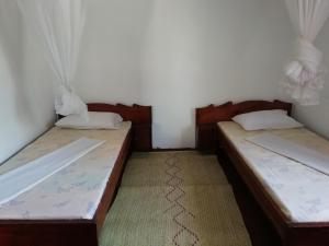 Postel nebo postele na pokoji v ubytování Sunny House Paje II