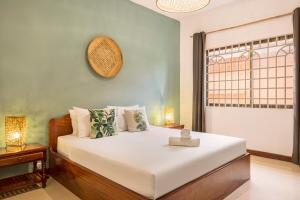 Postel nebo postele na pokoji v ubytování Babel Siem Reap Guesthouse + 37 fotografií