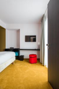 Postel nebo postele na pokoji v ubytování Hotel The Royal Snail