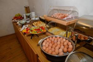 a buffet with eggs and other food on a counter at Hotel Kleis in Cvikov