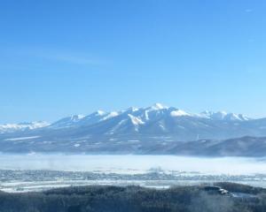 a view of a mountain range with snow covered mountains at Shin Furano Prince Hotel in Furano +255 photos