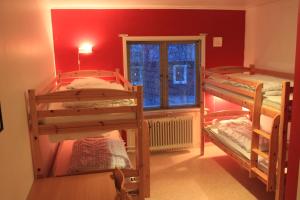 Voodi või voodid majutusasutuse Abisko net Hostel & Huskies toas