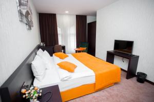 Ένα ή περισσότερα κρεβάτια σε δωμάτιο στο Da Vinci Boutique Hotel +39 φωτογραφίες