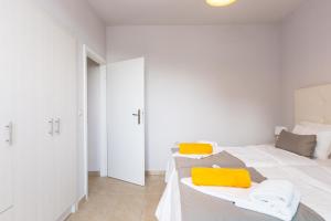Posteľ alebo postele v izbe v ubytovaní Sunset Maisonettes