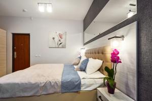 Postel nebo postele na pokoji v ubytování ANTARES Apart hotel
