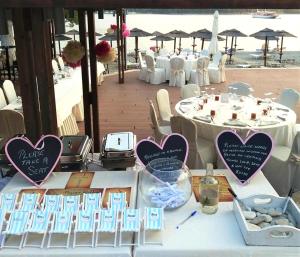 a table with hearts on top of it with tables with chairs at Blue Green Bay in Panormos Skopelos