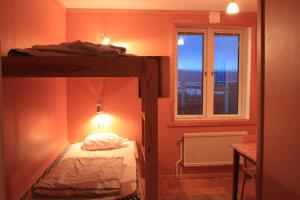 Voodi või voodid majutusasutuse Abisko net Hostel & Huskies toas