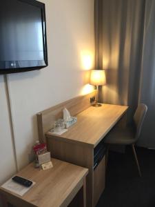 Televízia a/alebo spoločenská miestnosť v ubytovaní Restaurace a penzion U Hasičů