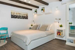 Postel nebo postele na pokoji v ubytování Apartments Kantunal