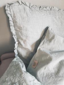 Postel nebo postele na pokoji v ubytování L'Ortodellerose