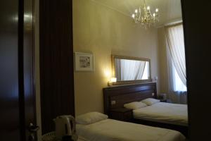 Cama o camas de una habitación en Schastie na Rubinsteina - Apartments