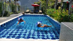 Swimmingpoolen hos eller tæt på Palm Bamboo Hotel