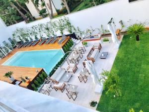 בריכת השחייה שנמצאת ב-Unìco Boutique Hotel d'Arte או באזור