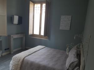 Postel nebo postele na pokoji v ubytování L'Ortodellerose