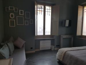 Postel nebo postele na pokoji v ubytování L'Ortodellerose