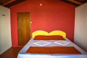 
A bed or beds in a room at Orange Sky Agonda
