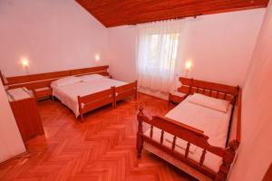 Postel nebo postele na pokoji v ubytování Villa Pinus