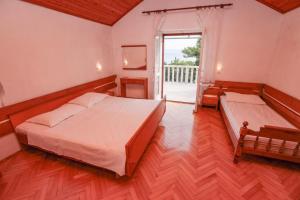 Postel nebo postele na pokoji v ubytování Villa Pinus
