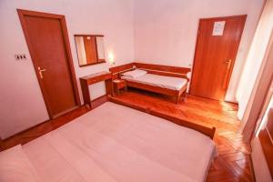 Postel nebo postele na pokoji v ubytování Villa Pinus