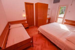 Postel nebo postele na pokoji v ubytování Villa Pinus