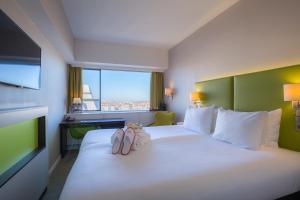 Katil atau katil-katil dalam bilik di Thon Hotel Brussels City Centre