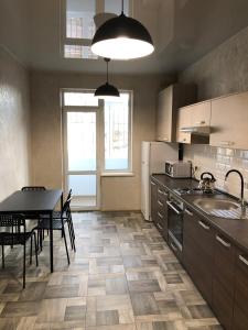 Virtuvė arba virtuvėlė apgyvendinimo įstaigoje Lux Apart Torfyana