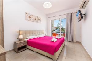Postel nebo postele na pokoji v ubytování Villa Maroula