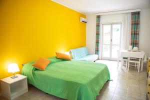 A bed or beds in a room at Portorosa Residence Még 29 kép