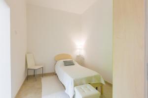 Ein Bett oder Betten in einem Zimmer der Unterkunft Lamia di Nonna Mena