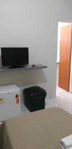 A television and/or entertainment center at Hotel Brasão