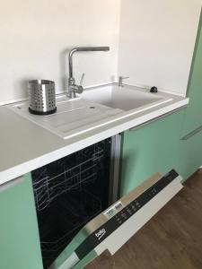 A kitchen or kitchenette at Apartman pri Radnici