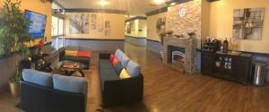 a large living room with couches and a fireplace at Days Hotel by Wyndham Danville Conference Center in Danville